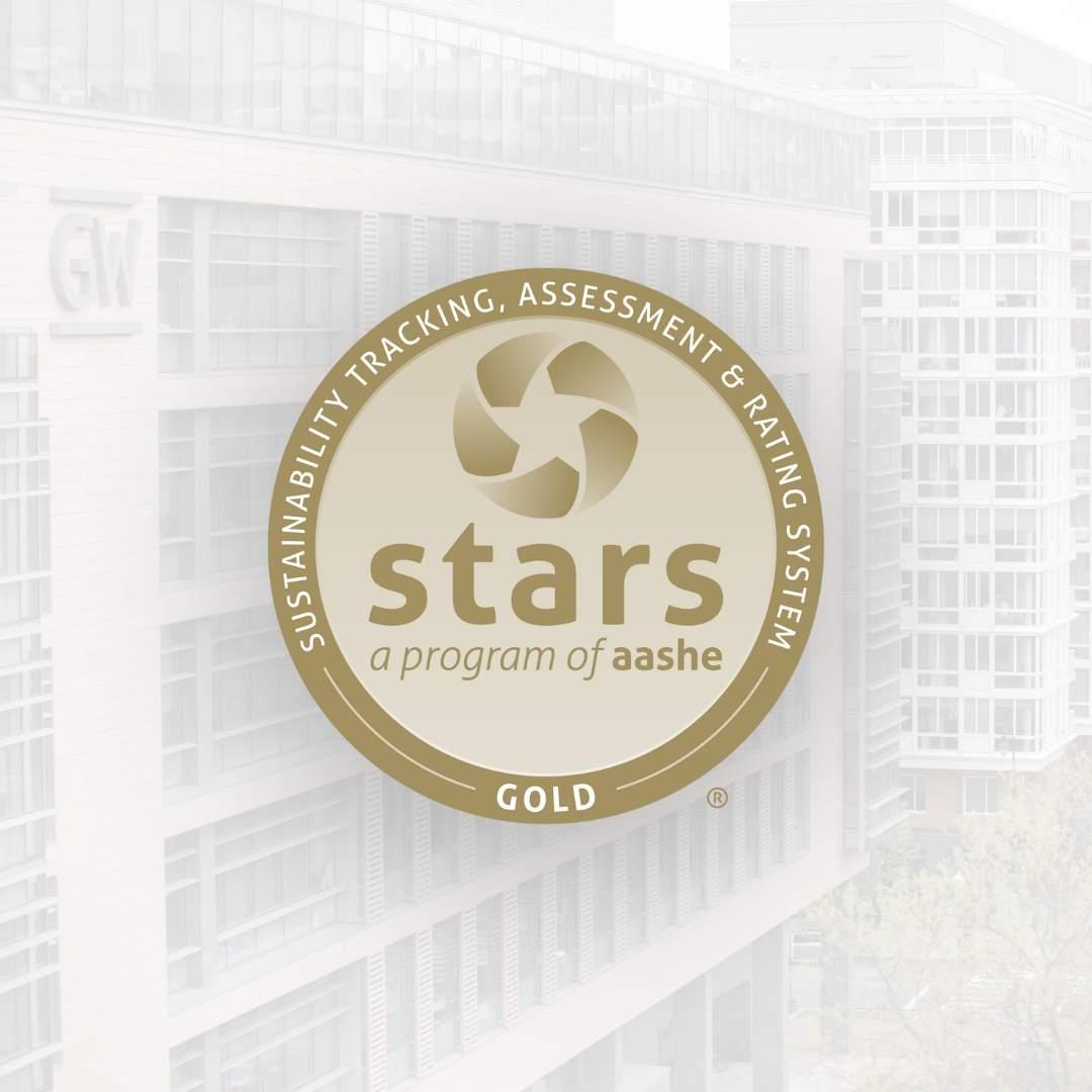 The STARS gold logo overlaid on a photo of GW campus buildings