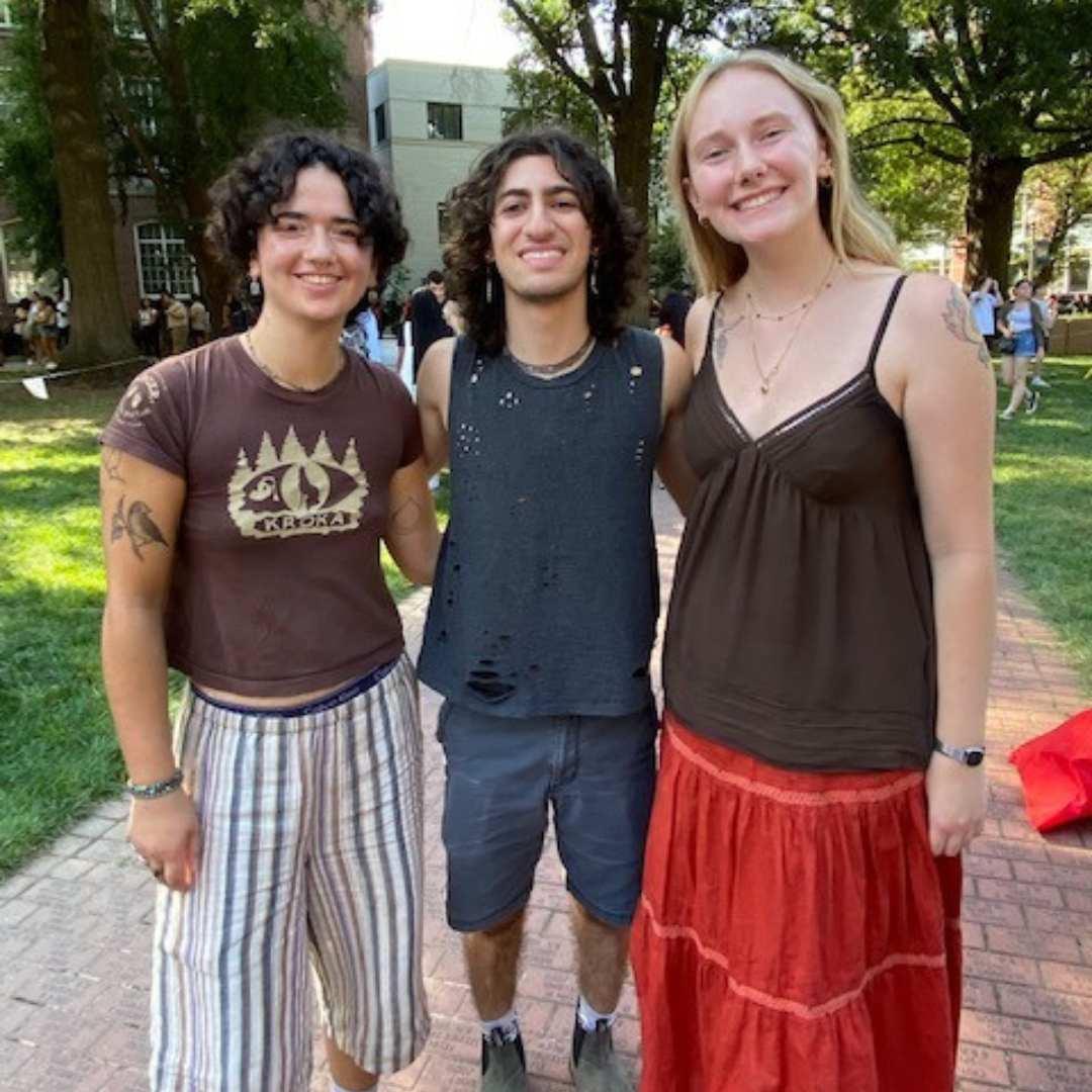 A group photo of 3 students at reuse market