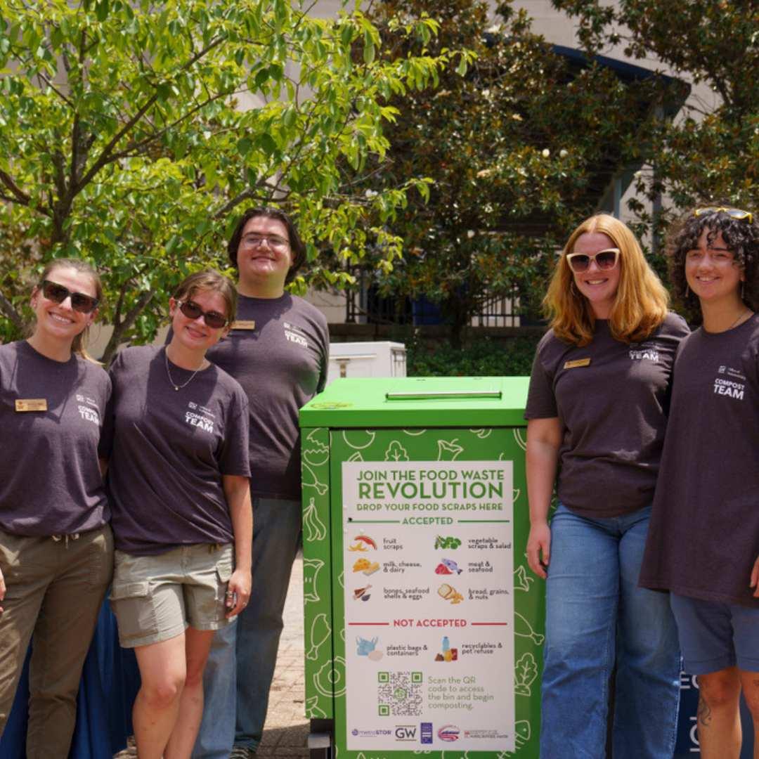 sustainable gw staff stand by the smart composter